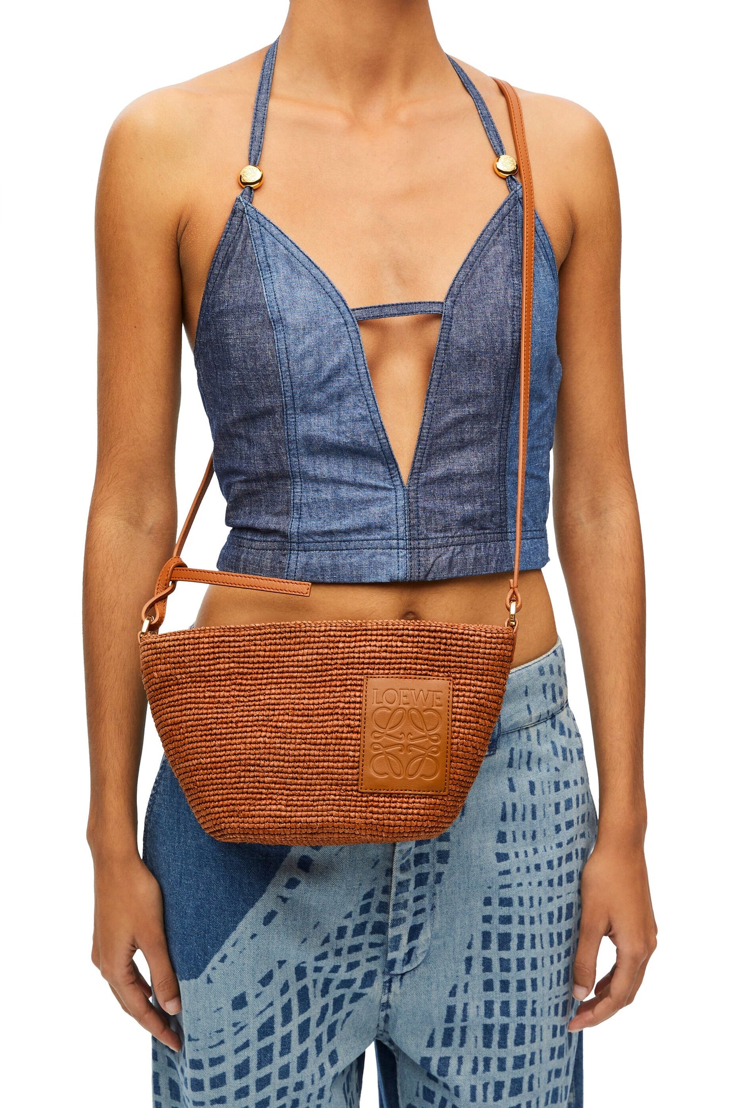 Slit Pochette bag in raffia and calfskin