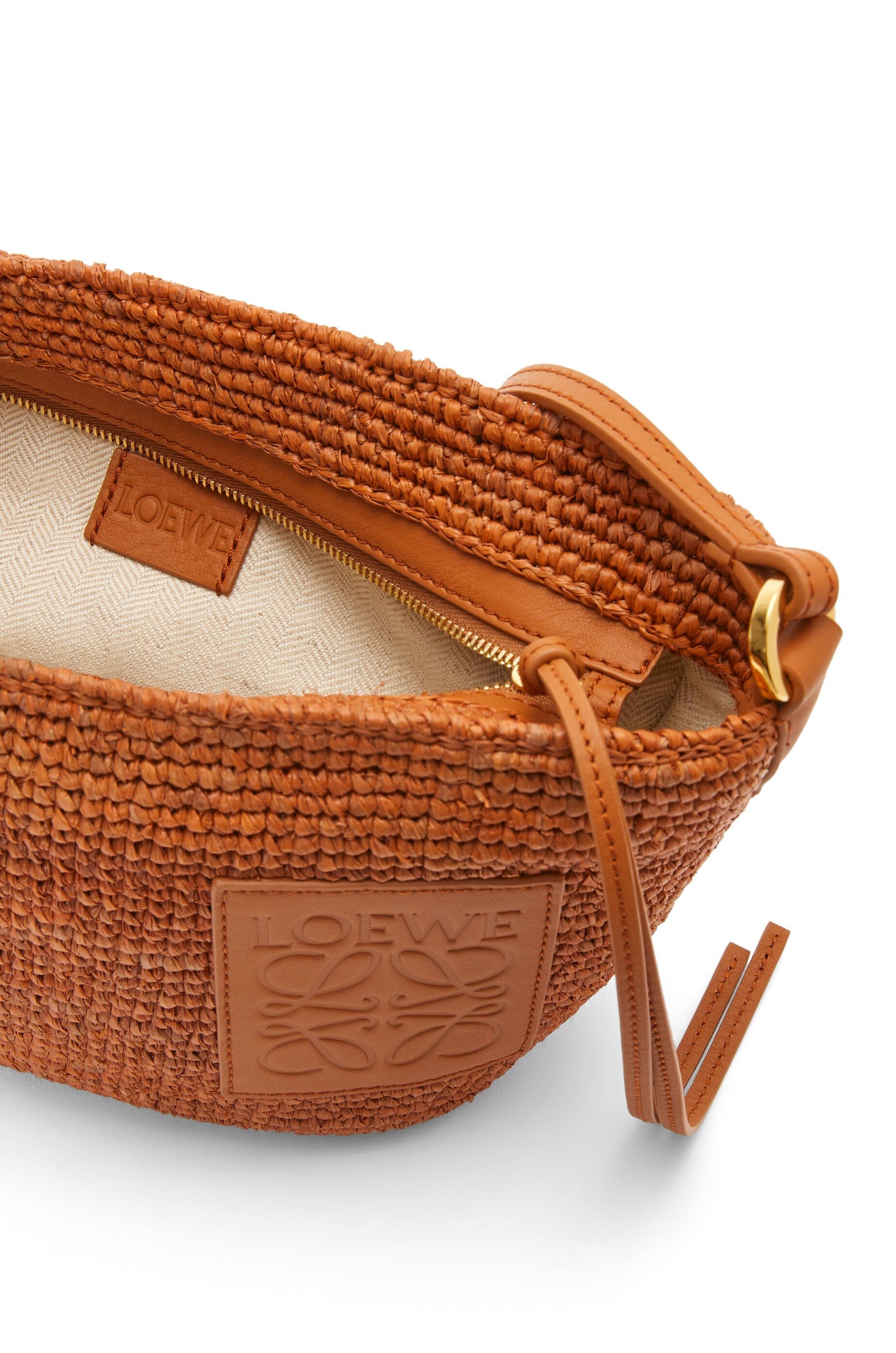 Slit Pochette bag in raffia and calfskin